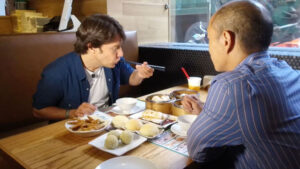 Tim Ho Wan - Picture of customers eating in a restaurant.