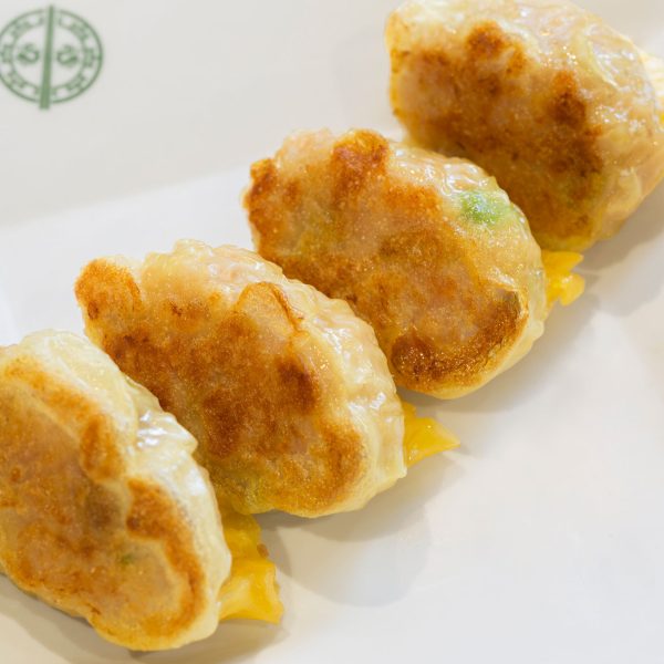 Tim Ho Wan - Picture of pan fired chicken dumplings with ginger essence
